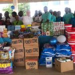 Rev.-Father-Cambell-receiving-items-from-Penyman-Group